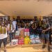 Members of Noble Second Floor present donated supplies to the National Palace of Corrections in Zwedru
