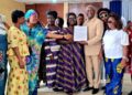 Grand Gedeh citizens present a plaque of honor to Dr. William Deiyan Towah during a recognition ceremony in Monrovia.