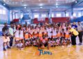 Young athletes posing during Flames Basketball Academy training program launch
