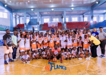Young athletes posing during Flames Basketball Academy training program launch