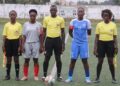 Match officials and captains pose before Small Town FC vs Determine Girls women’s league game