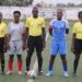 Match officials and captains pose before Small Town FC vs Determine Girls women’s league game