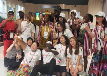 Liberia Expo 2025 delegation members posing at pavilion in Osaka, Japan