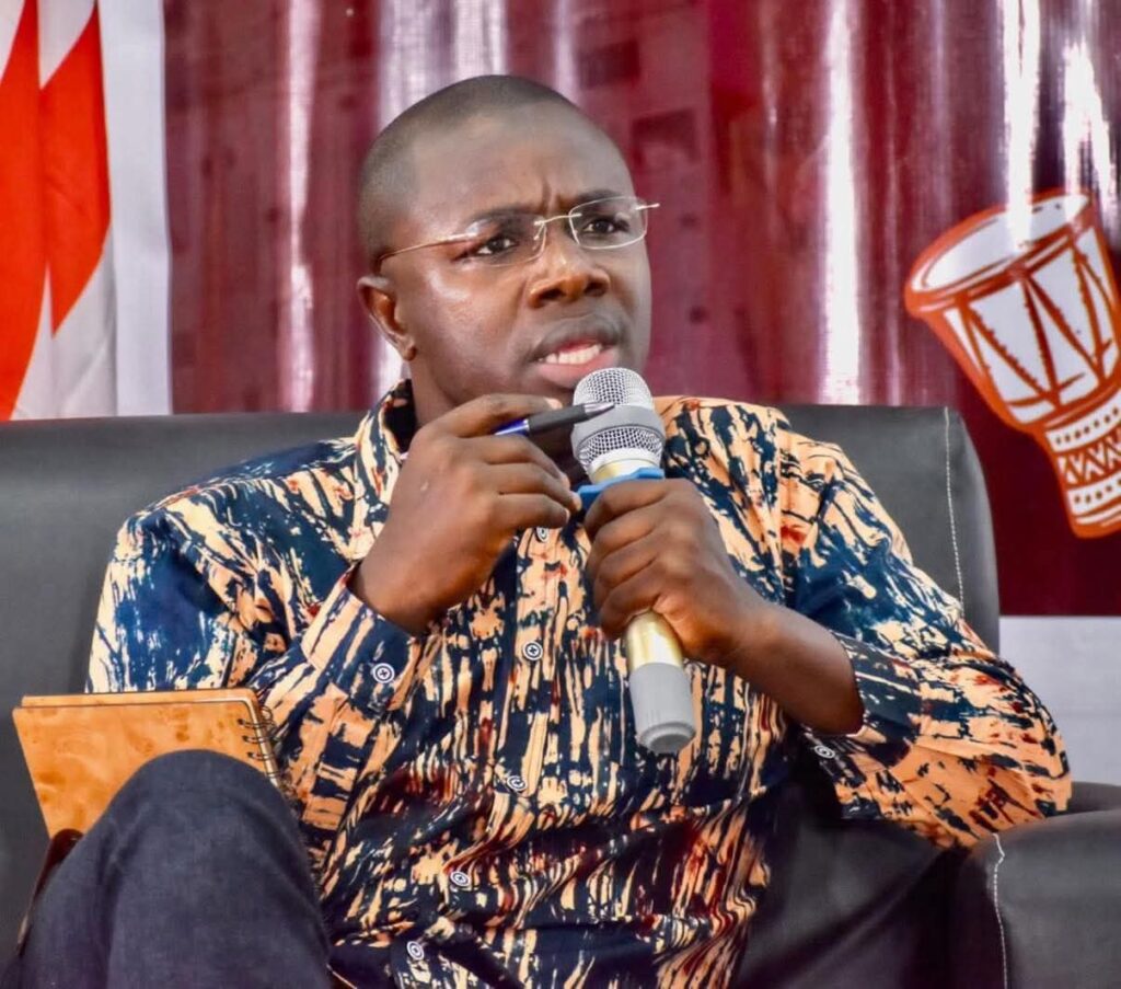 Opposition CDC Secretary General Jefferson Koijee speaking into a microphone