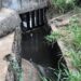 Drainage channel in Morris Farm community where residents suspect industrial discharge from nearby brewery operations