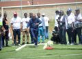Officials and athletes observe a ceremonial kick-off as kickball gains continental recognition.