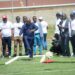Officials and athletes observe a ceremonial kick-off as kickball gains continental recognition.