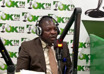 NaFAA Director General J. Cyrus Sagbe speaks during OK FM interview about fisheries investment conference