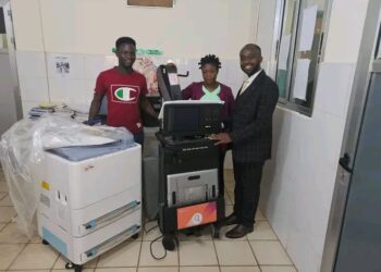 Medical staff pose with newly installed X-ray machine at C.B. Dunbar Hospital in Gbarnga, Bong County