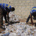 Youth volunteers sort collected plastic waste for recycling in Gbarnga, Bong County.