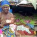 Elderly woman and baby left homeless after demolition in Saye Town, Liberia.