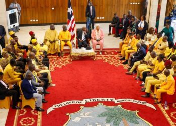 lawmakers assembled at the Executive Mansion to thank President Boakai for the bringing in the earth-moving equipment. They were all dressed in yellow