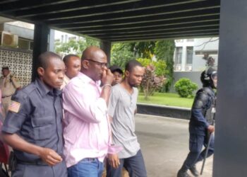 Former National Security Adviser Jefferson Karmoh being escorted from the court