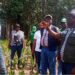 Agriculture Minister Alexander Nuetah visiting a farm during a tour promoting coconut seed garden projects in southeastern Liberia.