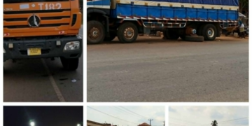Trucks improperly parked along roadside in Gbarnga creating traffic hazard