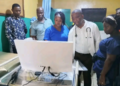 Health officials and medical staff inspect a newly donated colposcope machine at C.B. Dunbar Comprehensive Hospital in Gbarnga, Bong County.