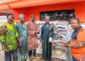 Rep. Moima Briggs Mensah presenting rice donation to Muslim community in Salala during Ramadan.