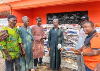 Rep. Moima Briggs Mensah presenting rice donation to Muslim community in Salala during Ramadan.