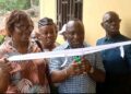Officials cut the ribbon during the dedication of the refurbished commissioner’s residence in Foequelleh, Bong County District #4.