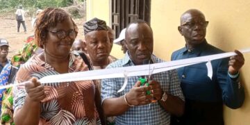 Officials cut the ribbon during the dedication of the refurbished commissioner’s residence in Foequelleh, Bong County District #4.
