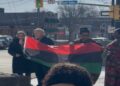Welland Mayor Frank Campion and community members raise the Pan-African flag during a Black History Month ceremony in Ontario.