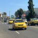 Yellow taxis operating on a busy street in Monrovia amid rising transport fares.