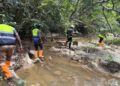 EPA and security personnel inspect Marvoe Creek following contamination linked to mining operations.