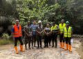 BMMC and EPA officials inspect Marvoe Creek fish kill site Liberia