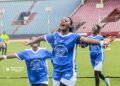 Liberia high school football players celebrating SKD championship