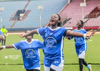 Liberia high school football players celebrating SKD championship
