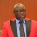 Representative Josiah Marvin Cole speaking at press briefing in Monrovia