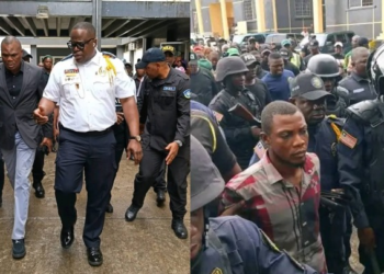 Liberia police escort suspect Francis Nana court appearance Monrovia