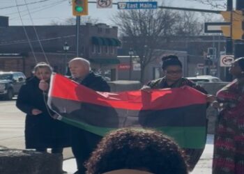 Welland Mayor Frank Campion and community members raise the Pan-African flag during a Black History Month ceremony in Ontario.