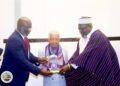 Former President Ellen Johnson Sirleaf receives a legislative citation from the Liberian House of Representatives.