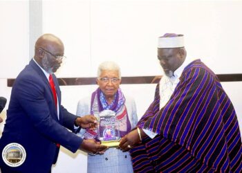 Former President Ellen Johnson Sirleaf receives a legislative citation from the Liberian House of Representatives.