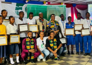 Liberian students holding certificates at ECOWAS 50th anniversary quiz competition in Kakata