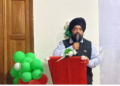 Upjit Singh Sachdeva speaking at podium during rubber industry event in Liberia