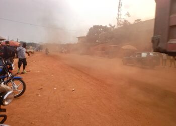 Dust rising from an unfinished road at Lofa Parking commercial area in Bong County, Liberia.