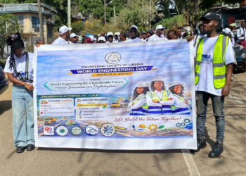 Engineers and students participate in a parade in Monrovia marking World Engineering Day organized by the Engineering Society of Liberia.
