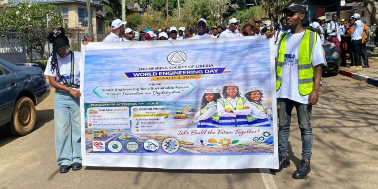 Engineers and students participate in a parade in Monrovia marking World Engineering Day organized by the Engineering Society of Liberia.