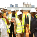 Liberian lawmakers and cabinet officials tour the new destination inspection facility under construction at the Freeport of Monrovia.