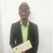 visually impaired man holding an envelope