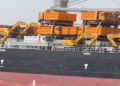 Heavy-duty yellow road construction machines delivered to Liberia to support national road infrastructure development.