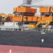 Heavy-duty yellow road construction machines delivered to Liberia to support national road infrastructure development.