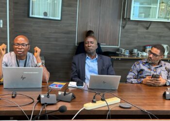 Central Bank official explaining Liberia’s banknote printing plan during a press conference
