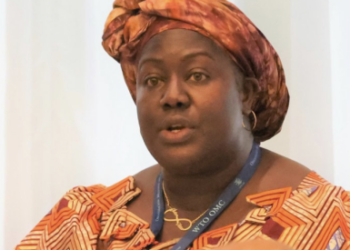 Liberian official speaking at an international meeting, illustrating leadership linked to government accountability and corruption case