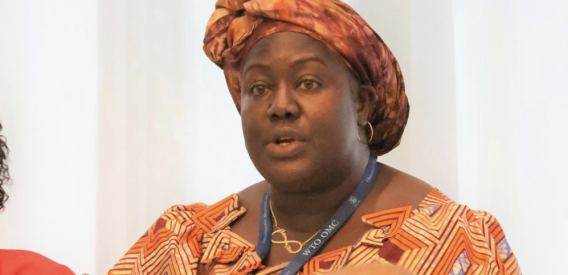 Liberian official speaking at an international meeting, illustrating leadership linked to government accountability and corruption case