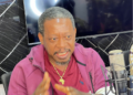 Former Representative Acarous Gray speaks during a radio interview criticizing the Boakai administration