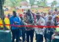 Officials and residents at ribbon-cutting ceremony for township hall project in Karluway District, Maryland County