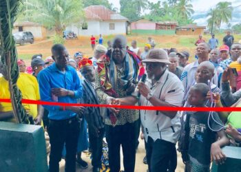 Officials and residents at ribbon-cutting ceremony for township hall project in Karluway District, Maryland County